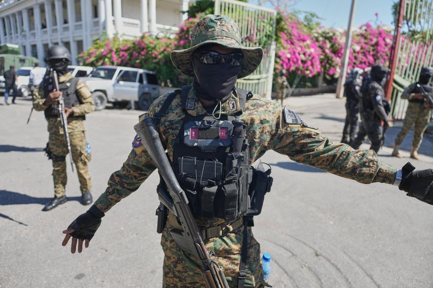 Members of the National Palace General Security Unit (USGPN) set up a security perimeter as Transitional Council President Laurent Saint-Cyr visits the headquarters of the armed forces in Port-au-Prince, Haiti, Monday, Jan. 26, 2026. (AP Photo/Odelyn Joseph)