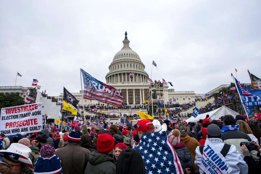 Rioters loyal to President Donald Trump rally at the U.S. Capitol in Washington on Jan. 6, 2021. (AP Photo/Jose Luis Magana, File)