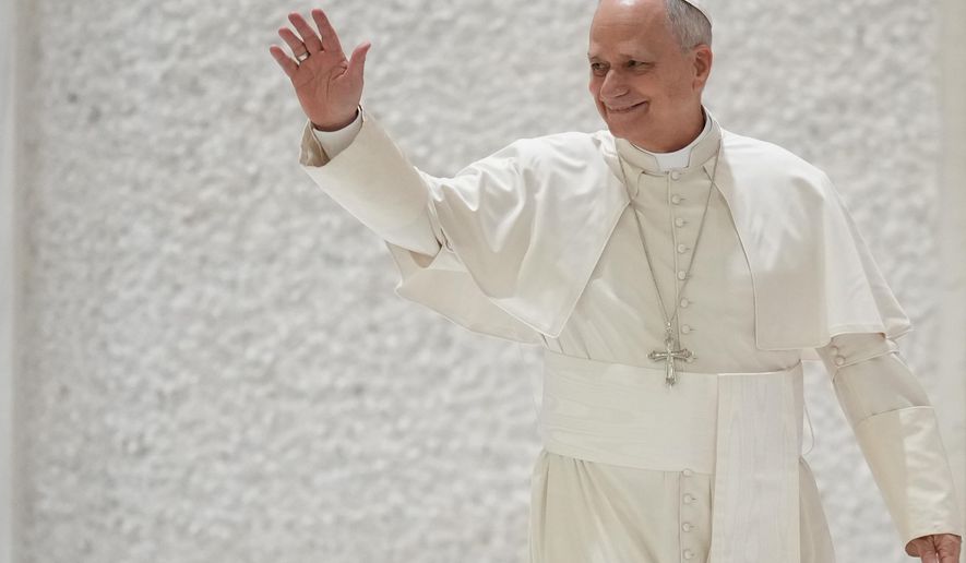 Pope Leo XIV arrives for his weekly general audience in the Pope Paul VI hall at the Vatican, Wednesday, Jan. 28, 2026. (AP Photo/Andrew Medichini)