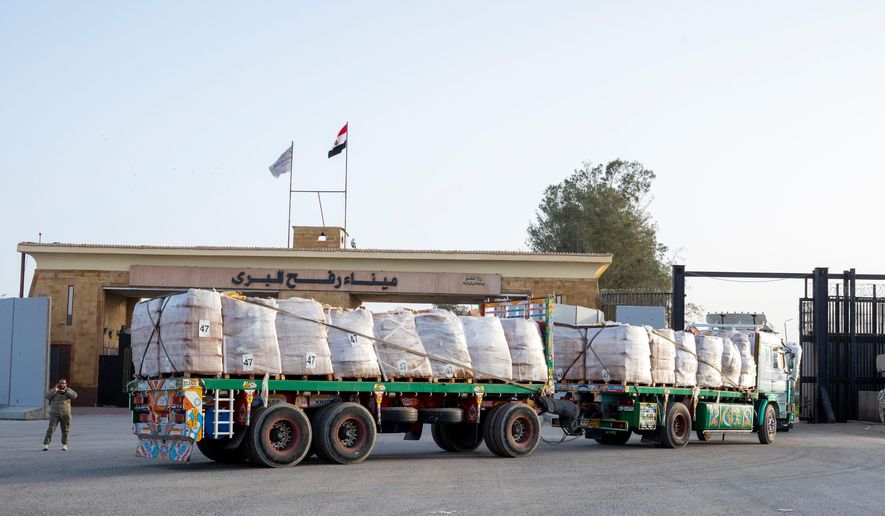 A truck enters the Egyptian gate of the Rafah crossing, heading for inspection by Israeli authorities before entering the Gaza Strip, Tuesday, Jan. 27, 2026. (AP Photo/Mohamed Arafat)