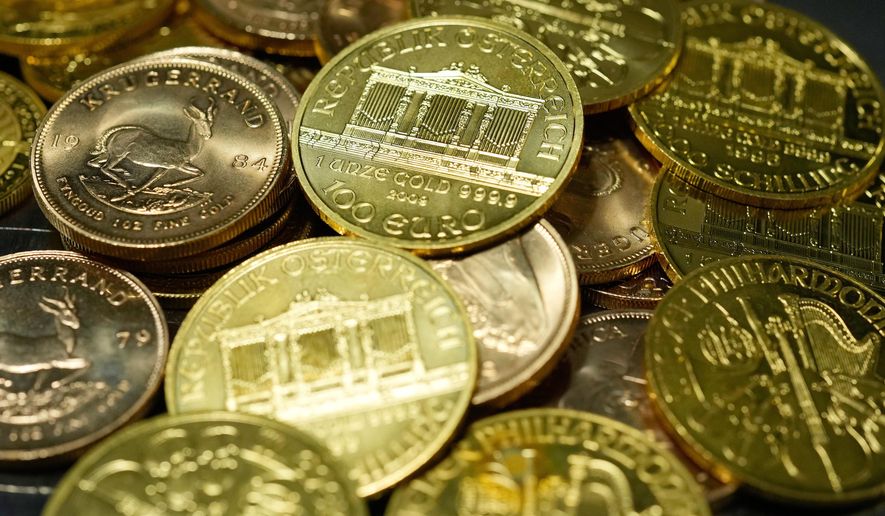 FILE - 1 Ounce Fine Gold Coins are displayed in the safe deposit boxes room at the Pro Aurum gold house in Munich, Germany, Friday, April 25, 2025. (AP Photo/Matthias Schrader, File)