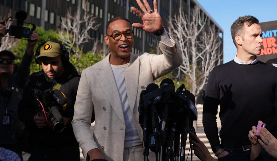 Journalist Don Lemon, waves to the media after a hearing outside the Edward R. Roybal Federal Building in Los Angeles on Friday, Jan. 30, 2026. (AP Photo/Damian Dovarganes)