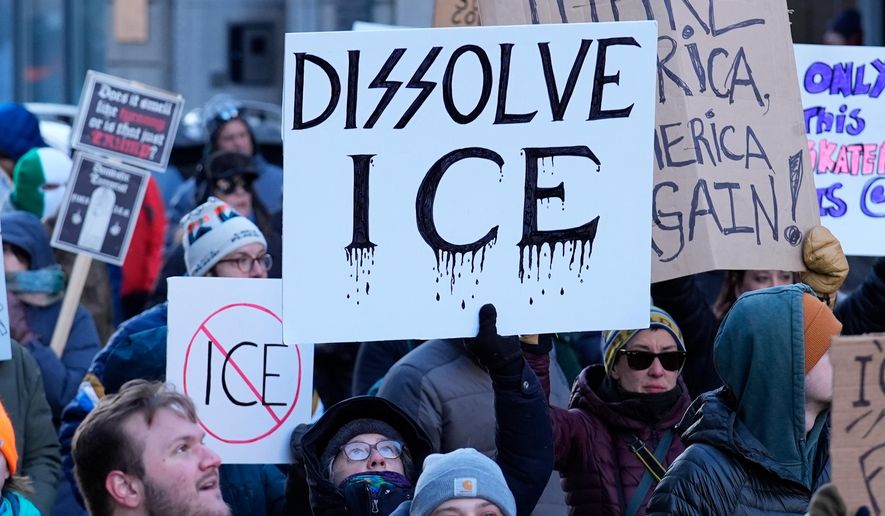 People protest against U.S. Immigrations and Customs enforcement in Portland, Maine, Friday, Jan. 30, 2026. (AP Photo/Robert F. Bukaty)