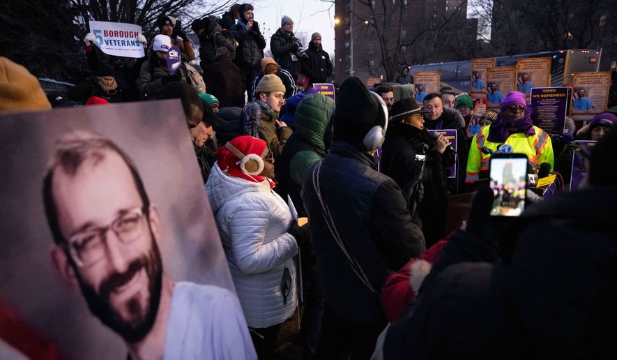 A photo of Alex Pretti is displayed during a vigil for Alex Pretti by nurses and their supporters outside VA NY Harbor Healthcare System, Thursday, Jan. 29, 2026, in New York. (AP Photo/Yuki Iwamura)