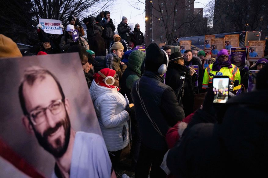 A photo of Alex Pretti is displayed during a vigil for Alex Pretti by nurses and their supporters outside VA NY Harbor Healthcare System, Thursday, Jan. 29, 2026, in New York. (AP Photo/Yuki Iwamura)