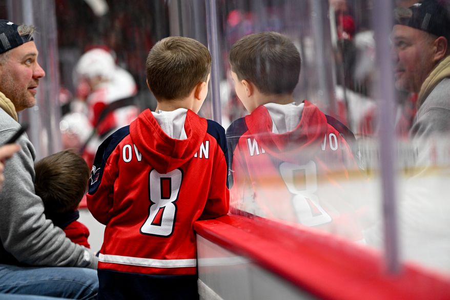 A young Washington Capitals fan watching play during the first period of an NHL game against the Carolina Hurricanes at Capital One Arena in Washington D.C., January 31, 2026. (Photo for the Washington Times)