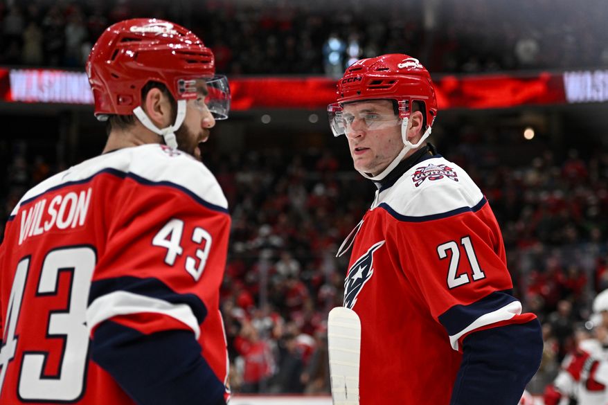 Washington Capitals center Alexei Protas (21) talking it over with teammate Tom Wilson (43) during the third period of an NHL game against the Carolina Hurricanes at Capital One Arena in Washington D.C., January 31, 2026. (Photo for the Washington Times)