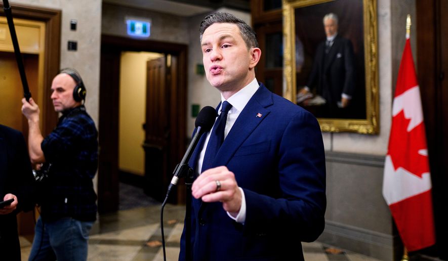 Conservative Leader Pierre Poilievre speaks in the foyer of the House of Commons on Parliament Hill in Ottawa, Thursday, Dec. 11, 2025. (Spencer Colby/The Canadian Press via AP, File