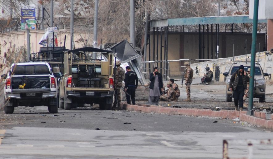 Pakistani army soldiers and other security officials examine a site following militants attack with guns and grenades, in Quetta, Pakistan, Saturday, Jan. 31, 2026. (AP Photo/Arshad Butt)
