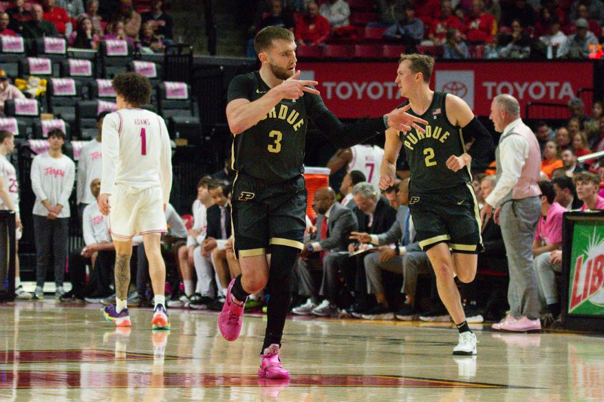 Purdue guards Braden Smith (3) and Fletcher Loyer (2) celebrate a 3-pointer in an NCAA basketball game against Maryland, Sunday, Feb. 1, 2026, in College Park, Md. (All-Pro Reels/Neil Dalal)