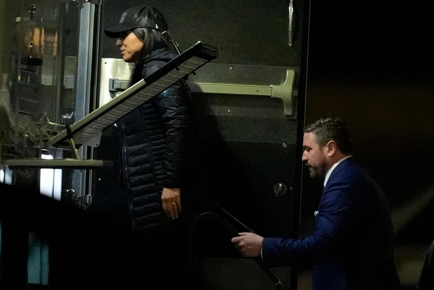 Director of National Intelligence Tulsi Gabbard, left, and FBI Deputy Director Andrew Bailey, enter a command vehicle as the FBI takes Fulton County 2020 Election ballots, Wednesday, Jan. 28, 2026, in Union City, Ga., near Atlanta. (AP Photo/Mike Stewart)