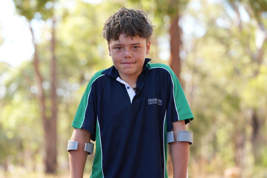 Austin Appelbee poses for a photo in Gidgegannup, Australia, Tuesday Feb. 3, 2026, after the 13-year-old made an hourslong swim to raise an alarm after his family was swept out to sea off the Australian coast. (Briana Shepherd/ABC via AP)