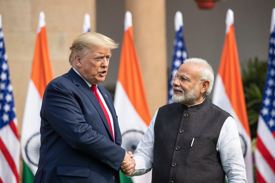 U.S. President Donald Trump and Indian Prime Minister Narendra Modi shake hands before their meeting at Hyderabad House, Feb. 25, 2020, in New Delhi, India. (AP Photo/Alex Brandon, File)