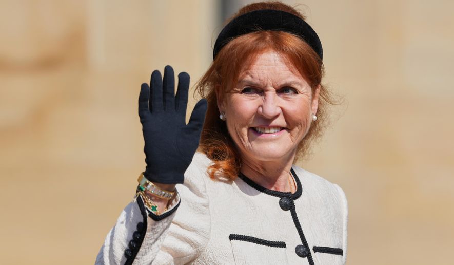 Sarah Ferguson waves the to the crowd was she attends the Easter Matins Service at St. George's Chapel, Windsor Castle, England, Sunday, April 20, 2025. (AP Photo/Kirsty Wigglesworth, file)