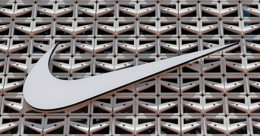 The Nike logo is shown on a store in Miami Beach, Fla. on Aug. 8, 2017. (AP Photo/Alan Diaz, File)