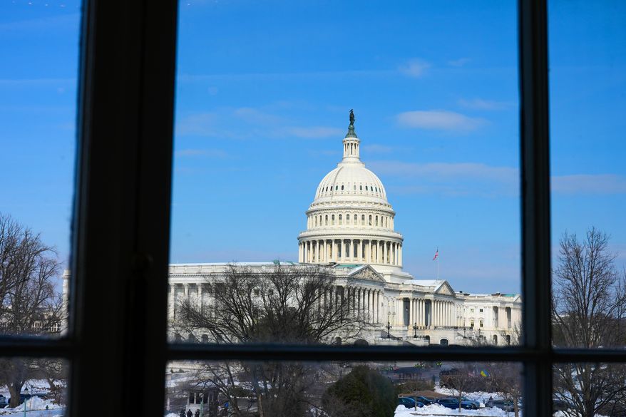 The US Capitol is visible through the Cannon House Office Building, Tuesday, Feb. 3, 2026, in Washington. (AP Photo/Mariam Zuhaib)