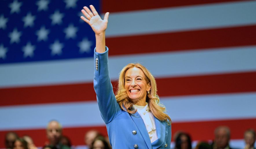 New Jersey Gov. Mikie Sherrill waves during her inauguration ceremony in Newark, N.J., Tuesday, Jan. 20, 2026. (AP Photo/Seth Wenig, File)