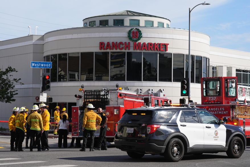 First responders work the scene of a fatal crash outside of a 99 Ranch Market, Thursday, Feb. 5, 2026, in the Westwood neighborhood of Los Angeles.(AP Photo/Damian Dovarganes)