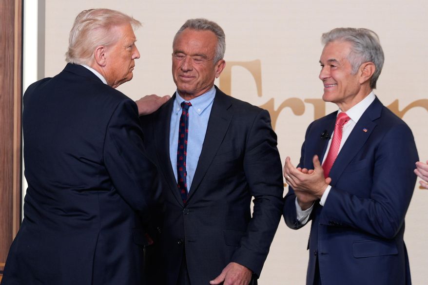 President Donald Trump greets Health and Human Services Secretary Robert F. Kennedy Jr. and Centers for Medicare & Medicaid Services administrator Dr. Mehmet Oz after an event about TrumpRx in the South Court Auditorium in the Old Eisenhower Executive Office Building on the White House campus, Thursday, Feb. 5, 2026, in Washington. (AP Photo/Alex Brandon) ** FILE **