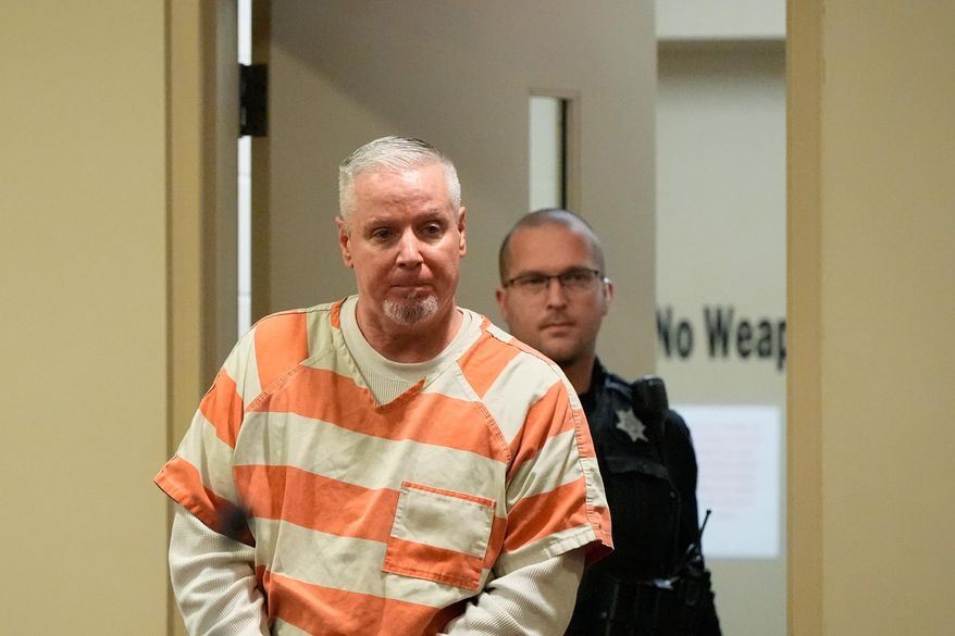 FILE - Colin Gray, the father of Apalachee High School shooting suspect Colt Gray, arrives to the courtroom at the Barrow County courthouse on Thursday, Dec. 18, 2025, in Winder,Ga. (AP Photo/Brynn Anderson, File)