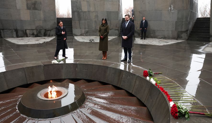 U.S. Vice President JD Vance, second lady Usha Vance and Edita G. Gzoyan, director of the Armenian Genocide Museum-Institute, pay tribute at the eternal flame during a visit to the Tsitsernakaberd Armenian Genocide Memorial in Yerevan, Armenia Tuesday, Feb. 10, 2026. (Kevin Lamarque/Pool Photo via AP)