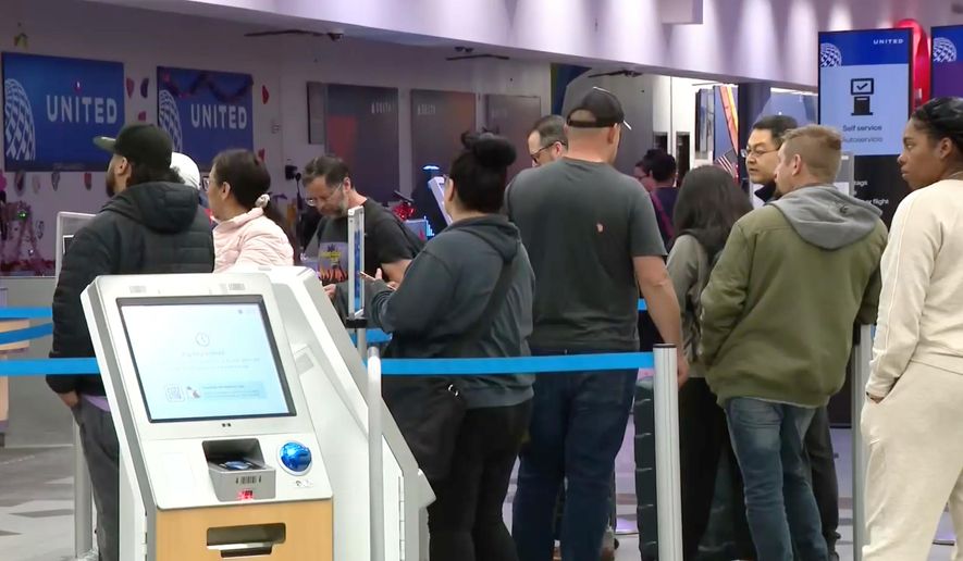 Passengers wait in line at the El Paso International Airport after all flights were grounded on Wednesday, Feb. 11, 2026. (KFOX via AP)