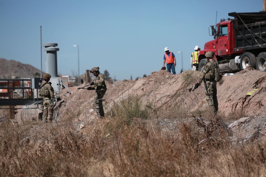 Security forces install barbed wire along the U.S. border in Ciudad Juarez, Mexico, on Wednesday, Feb. 11, 2026, near El Paso, Texas. (AP Photo/Christian Chavez) **FILE**