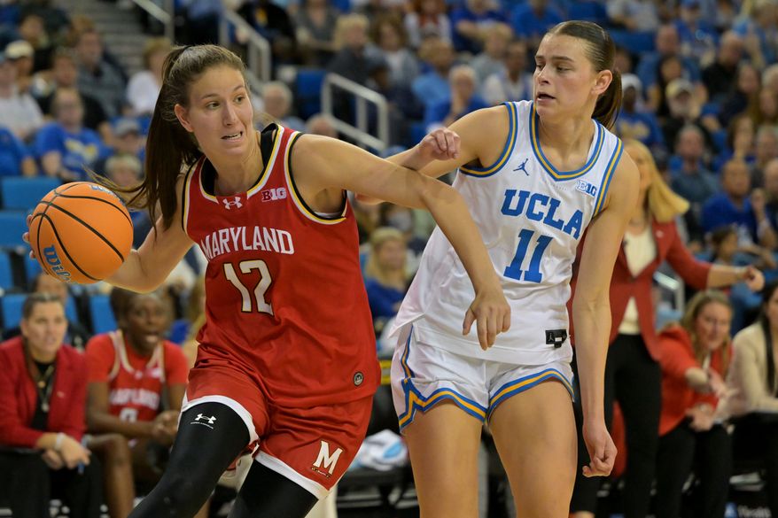 Maryland guard Yarden Garzon (12) is defended by UCLA guard Gabriela Jaquez during the second half of an NCAA college basketball game Sunday, Jan. 18, 2026, in Los Angeles. (AP Photo/Jayne Kamin-Oncea)