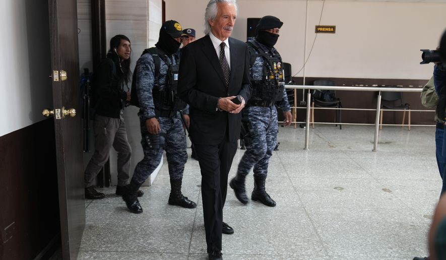 Guatemalan journalist Jose Ruben Zamora, founder of El Periódico newspaper, arrives for his court hearing in Guatemala City, Thursday, Feb. 12, 2026. (AP Photo/Moises Castillo)