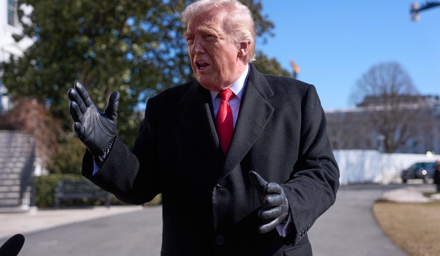 President Donald Trump speaks with reporters before boarding Marine One on the South Lawn of the White House, Friday, Feb. 13, 2026, in Washington. (AP Photo/Evan Vucci)