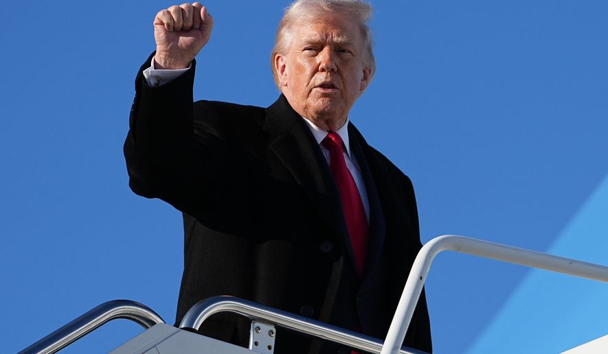 President Donald Trump gestures as he boards Air Force One at Pope Army Airfield, in Fort Bragg, N.C., Friday, Feb. 13, 2026, en route to Palm Beach, Fla. (AP Photo/Matt Rourke)