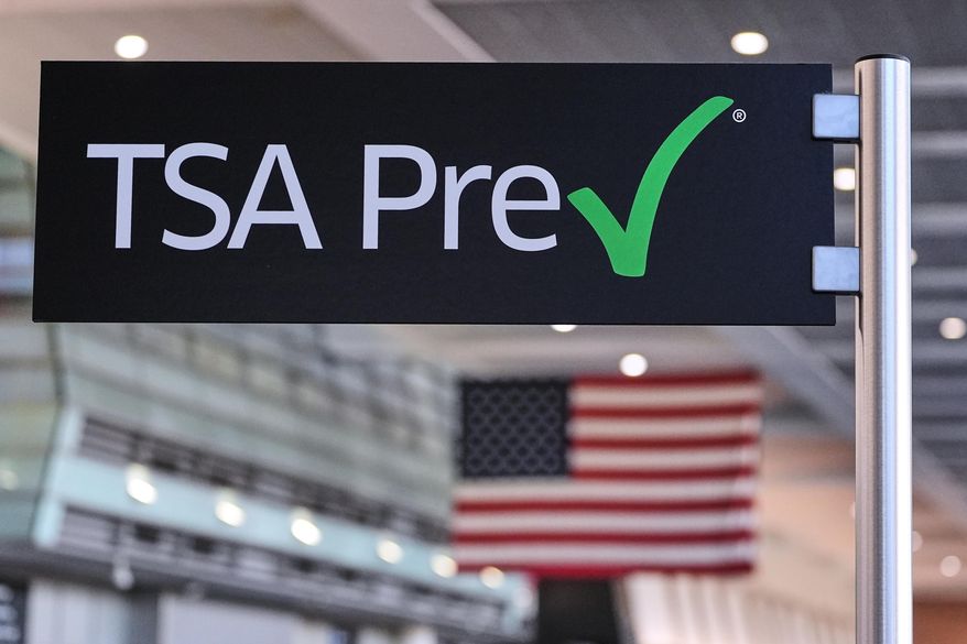 FILE - A TSA Pre sign is posted at a security line in Terminal A at Logan Airport, Dec. 9, 2025, in Boston. (AP Photo/Charles Krupa, File)