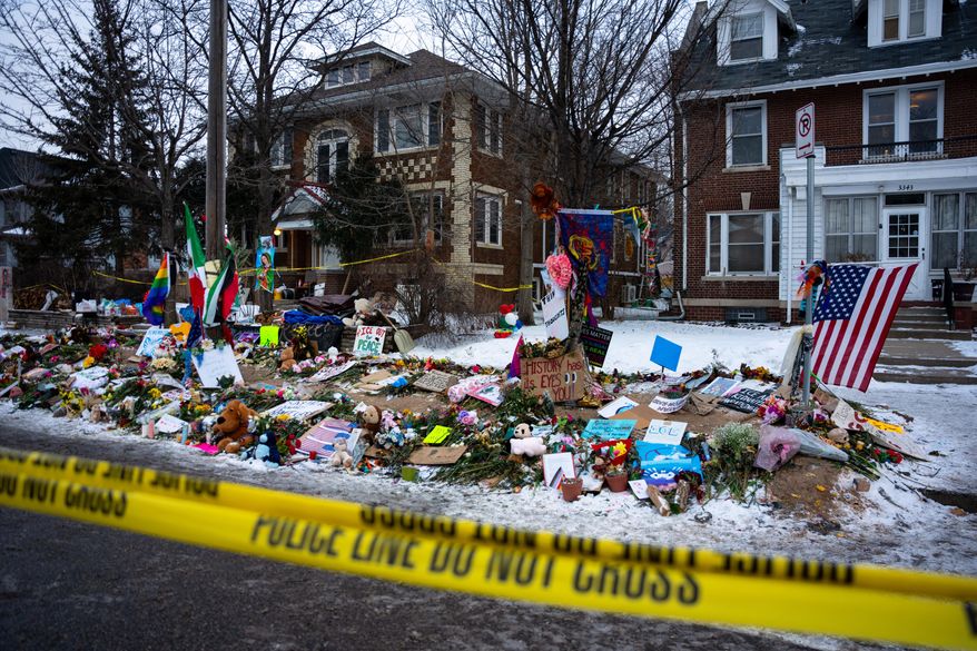 A makeshift memorial for Renee Good, who was fatally shot by an ICE officer on Jan. 7, is seen Tuesday, Jan. 20, 2026, in Minneapolis. (AP Photo/Angelina Katsanis)