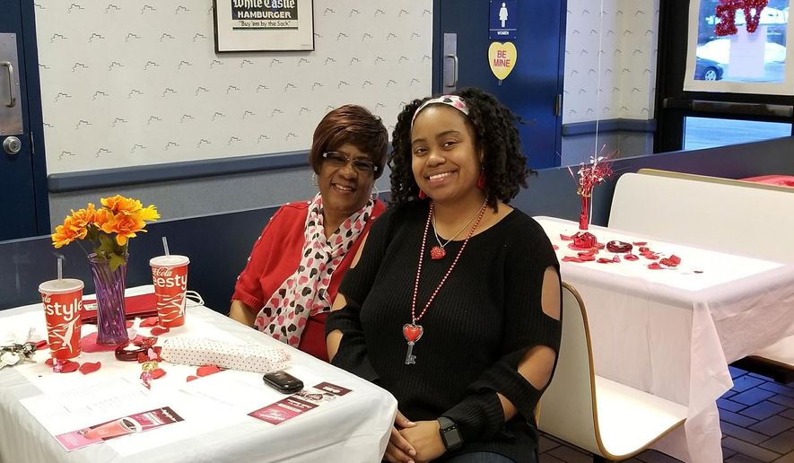 In this undated photo, Krystal Gray, 43, of Detroit, and her mother, Cornelia Murphy, celebrate Valentine's Day inside a Detroit-area White Castle. (Krystal Gray via AP)