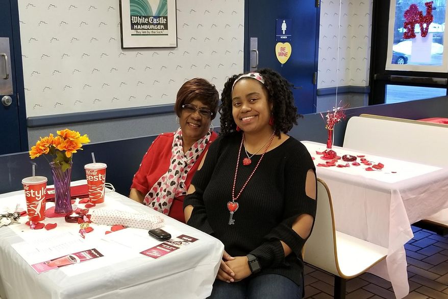 In this undated photo, Krystal Gray, 43, of Detroit, and her mother, Cornelia Murphy, celebrate Valentine's Day inside a Detroit-area White Castle. (Krystal Gray via AP)
