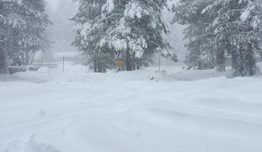 Snow falls on Tuesday, Feb. 17, 2026 in Truckee Calif. (AP Photos/Brooke Hess-Homeier)