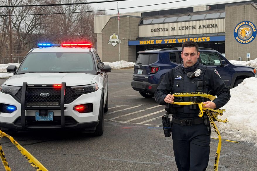 Police continue to tape off the Dennis M. Lynch arena a day after a deadly shooting during a youth hockey game on Tuesday, Feb. 17, 2026 in Pawtucket, R.I. (AP Photo/Rodrique Ngowi)