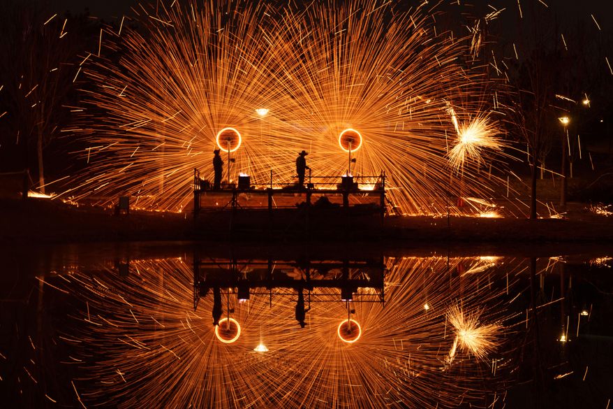 Chinese folk performance known as da shuhua, or molten iron fireworks ahead of Lunar New Year celebrations in Beijing, China, Monday, Feb. 9, 2026. (AP Photo/Vincent Thian)