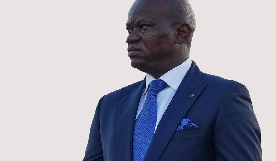 FILE - Gabon's President Brice Oligui Nguema waits to welcome France's President Emmanuel Macron at the Leon-Mba International Airport in Libreville, Gabon, Sunday, Nov. 23, 2025. (AP Photo/Thibault Camus, file)