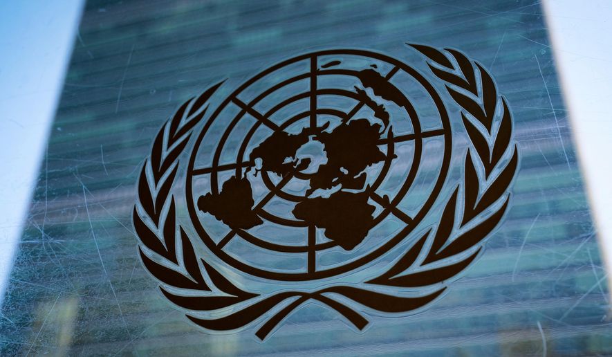 The symbol of the United Nations is displayed outside the Secretariat Building, Feb. 28, 2022, at United Nations Headquarters. (AP Photo/John Minchillo, File)