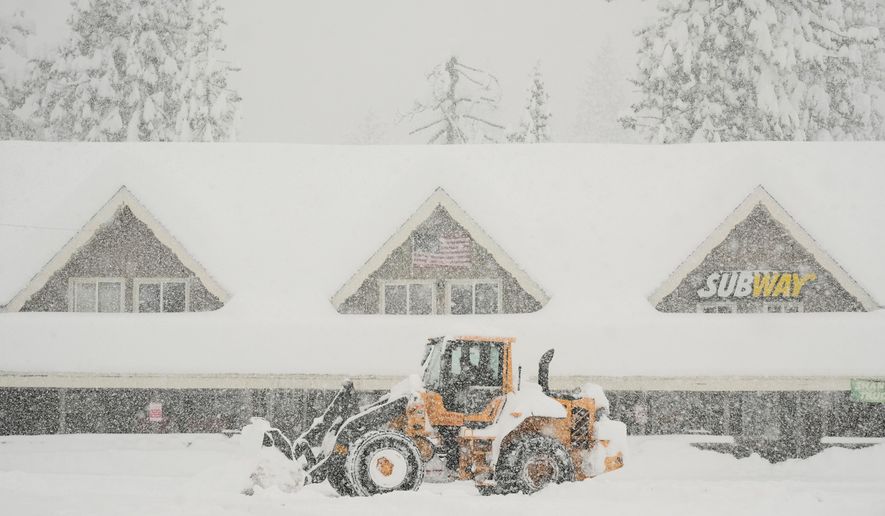 Snow is plowed in front of businesses during a snow storm Thursday, Feb. 19, 2026, in Soda Springs, Calif. (AP Photo/Godofredo A. Vásquez)