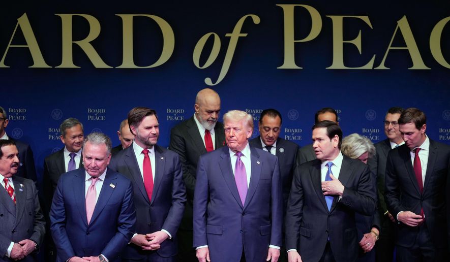 President Donald Trump, center, with Vice President JD Vance to his left, and Secretary of State Marco Rubio to his right, arrives for a Board of Peace meeting at the U.S. Institute of Peace, Thursday, Feb. 19, 2026, in Washington. (AP Photo/Mark Schiefelbein)