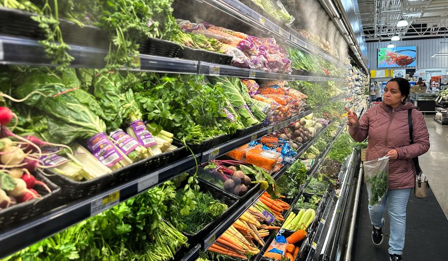 FILE - A person shops at a grocery store in Schaumburg, Ill., Monday, Feb. 9, 2026. (AP Photo/Nam Y. Huh, File)