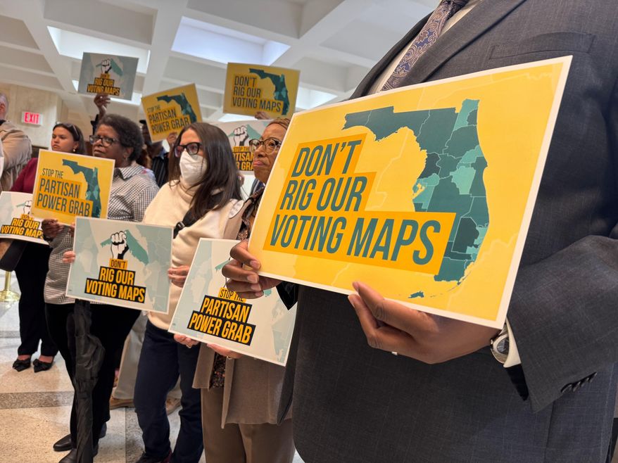 FILE - Opponents of mid-decade efforts to redraw congressional voting districts gather to protest in the Florida Capitol in Tallahassee, Fla., Dec. 2, 2025. (AP Photo/Kate Payne, File)