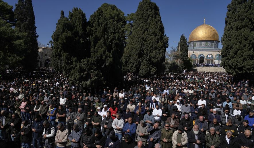 Muslim worshippers offer prayer on the first Friday of the holy month of Ramadan at the Al-Aqsa Mosque compound in Jerusalem's Old City, Friday, Feb. 20, 2026. (AP Photo/Mahmoud Illean)
