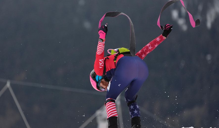 United States' Cameron Smith strips off his skins during a ski mountaineering mixed relay, at the 2026 Winter Olympics, in Bormio, Italy, Saturday, Feb. 21, 2026. (AP Photo/Rebecca Blackwell)
