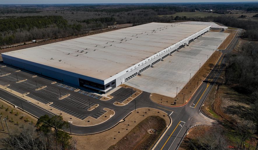 A newly built warehouse is seen on Friday, Feb. 6, 2026, in Social Circle, Ga., where officials are concerned about U.S. Immigrations and Customs Enforcement's plans connected to a $45-billion expansion of immigrant detention centers. (AP Photo/Mike Stewart)