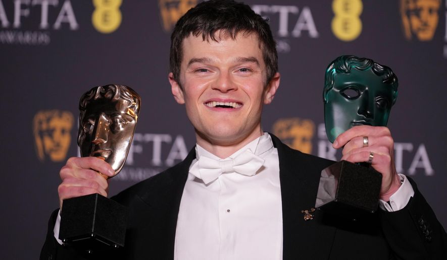 Robert Aramayo poses with the EE rising star award and the award for leading actor for 'I Swear' at the 79th British Academy Film Awards, BAFTA's, in London, Sunday, Feb. 22, 2026. (AP Photo/Alastair Grant)