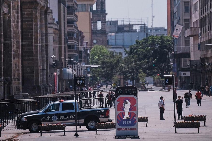 Police officers stand guard in downtown Guadalajara, Jalisco state, Mexico, Sunday, Feb. 22, 2026, after the death of the leader of the Jalisco New Generation Cartel, Nemesio Rubén Oseguera Cervantes, known as "El Mencho." (AP Photo/Alejandra Leyva)