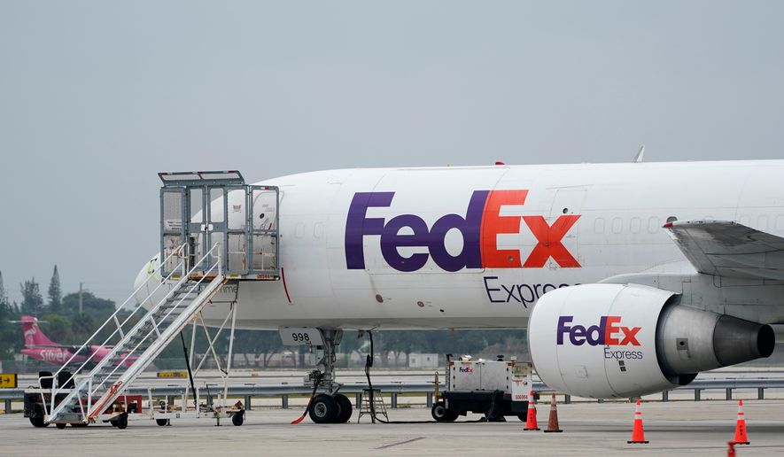 A FedEx cargo plane is shown on the tarmac at Fort Lauderdale-Hollywood International Airport, Tuesday, April 20, 2021, in Fort Lauderdale, Fla. (AP Photo/Wilfredo Lee) **FILE**